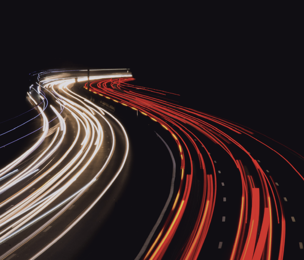 Photo of a highway with car lights in a line